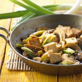 Pan-cooked tofu and mushrooms with spring onions