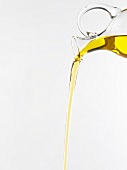 Pouring olive oil from carafe