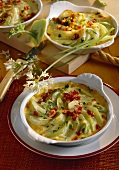 Kohlrabi gratin with diced ham and spring onions