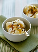 Lemon and coconut ice cream with passion fruit sauce