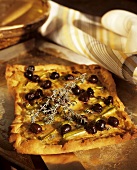 Pizza with olives and thyme