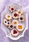 Jam biscuits on white plate (overhead view)