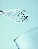 Whisk with glass container, close-up