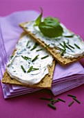 Rye crispbread with soft cheese and herbs