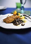 Fish in batter with pineapple and rocket and lentil compote