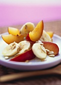 Plum and banana salad with toasted sunflower seeds