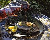 Grilled sea bream with rosemary and lemon slices on plate