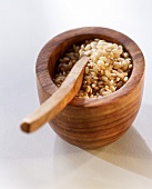 Brown short-grain rice in a wooden bowl