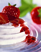 Meringue Topped with Strawberry Sauce and Strawberries