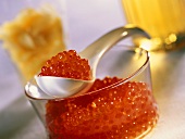 Salmon roe in small bowl and on spoon