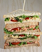 Multi-Layer Sandwich with Ham, Cheese, Tomato and Lettuce