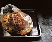 Roast pork with fruit & vegetables in transparent film