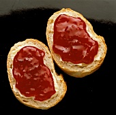 Baguette spread with raspberry jam