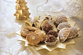 Assorted Christmas biscuits & sweets on star-shaped plate
