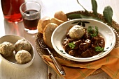 Goulash with bread dumplings and bread
