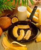 Fried bananas in the pan, with banana milk