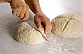 Cutting a cross in bread dough