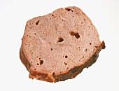 A slice of liver cheese (meatloaf), fried