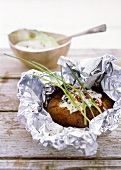 Baked potato and crème fraiche with herbs