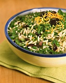 Rice-shaped pasta with parsley and olives
