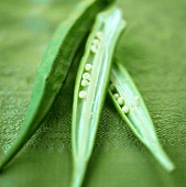 Okra pods on a green background