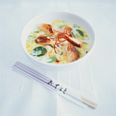 Salmon fillet with noodles in coconut and curry sauce