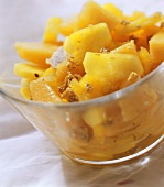Melon and pineapple salad with sesame praline