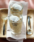 Cappuccino mousse with cream topping in glass