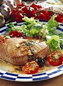 Fried tuna with cocktail tomatoes and salad