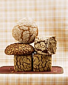 Various types of wholemeal bread (in a pile)