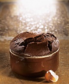 Chocolate soufflé in brown baking dish