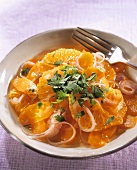 Carrot and orange salad with onions and coriander leaves