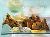 Fish nuggets with rocket and two dips