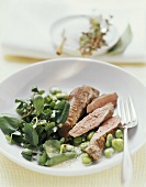 Lamb fillet in garlic buttermilk with beans and cress