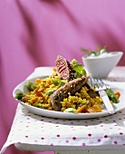 Lamb fillet on couscous with vegetables