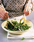Making parsley salad: mixing the ingredients