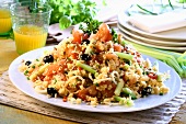 Couscous salad with vegetables; orange juice