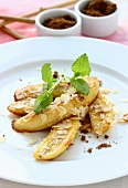 Fried bananas with flaked almonds