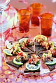 Pumpernickel with herring tartare; party decorations