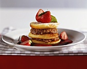 Choux pastry and nut tower with strawberries