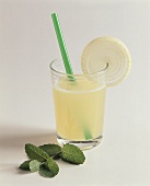 Onion juice in glass with straw