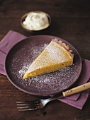 Piece of pumpkin pie with icing sugar