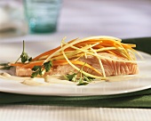 Sweet and sour marinated salmon with strips of vegetables
