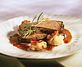 Roast venison with fruity sauce and dumplings