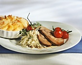 Slices of roast veal on Riesling sauerkraut with potato gratin