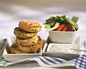 Millet burgers with chive sauce and salad