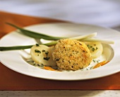 Millet burgers with boiled potatoes and chive sauce
