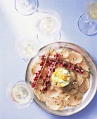 Fish carpaccio with egg and beetroot
