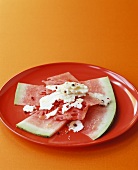 Watermelon slices with feta and pink pepper
