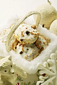 Macaroons in basket, surrounded by Christmas decorations